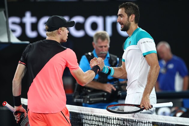 MELBOURNE, AUSTRALIA - JANUARY 25:  Kyle Edmund (L) of Great Britain congratulates Marin Cilic of Croatia after Cilic won their semi-final match on day 11 of the 2018 Australian Open at Melbourne Park on January 25, 2018 in Melbourne, Australia.  (Photo by Clive Brunskill/Getty Images)
