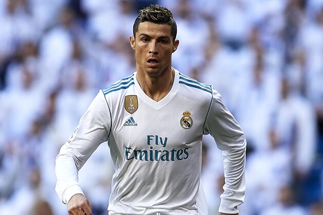 MADRID, SPAIN - JANUARY 21:  Cristiano Ronaldo of Real Madrid runs with the ball during the La Liga match between Real Madrid and Deportivo de La Coruna at Estadio Santiago Bernabeu on January 21, 2018 in Madrid, Spain.  (Photo by fotopress/Getty Images)