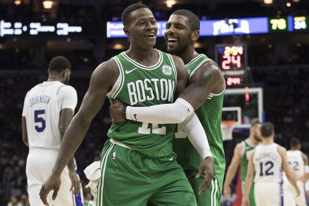 Boston Celtics' Terry Rozier III, left, celebrates with Kyrie Irving during the second half of a preseason NBA basketball game against the Philadelphia 76ers, Friday, Oct. 6, 2017, in Philadelphia. The Celtics won 110-102. (AP Photo/Chris Szagola)