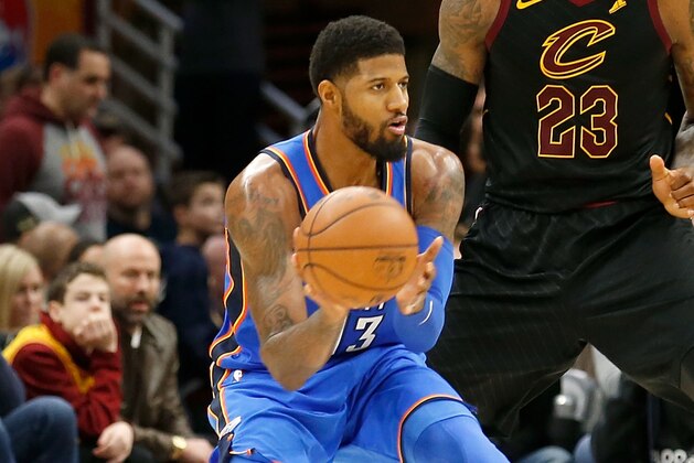 CLEVELAND, OH - JANUARY 20: Paul George #13 of the Oklahoma City Thunder passes the ball to a teammate during the game against the Cleveland Cavaliers at Quicken Loans Arena on January 20, 2018 in Cleveland, Ohio. Oklahoma City defeated Cleveland 148-124. NOTE TO USER: User expressly acknowledges and agrees that, by downloading and or using this photograph, User is consenting to the terms and conditions of the Getty Images License Agreement. (Photo by Kirk Irwin/Getty Images) CLEVELAND, OH - JANUARY 20: Paul George #13 of the Oklahoma City Thunder passes the ball to a teammate during the game against the Cleveland Cavaliers at Quicken Loans Arena on January 20, 2018 in Cleveland, Ohio. Oklahoma City defeated Cleveland 148-124. NOTE TO USER: User expressly acknowledges and agrees that, by downloading and or using this photograph, User is consenting to the terms and conditions of the Getty Images License Agreement. (Photo by Kirk Irwin/Getty Images)