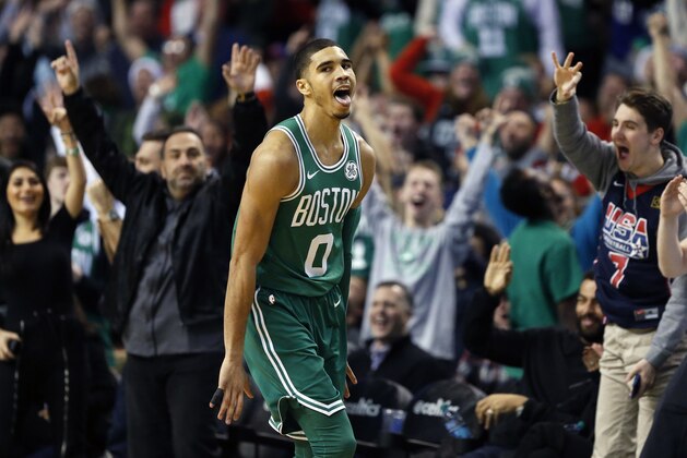 Boston Celtics' Jayson Tatum reacts after making a three-pointer during the fourth quarter of an NBA basketball game against the Washington Wizards in Boston, Monday, Dec. 25, 2017. The Wizards won 111-103. (AP Photo/Michael Dwyer)