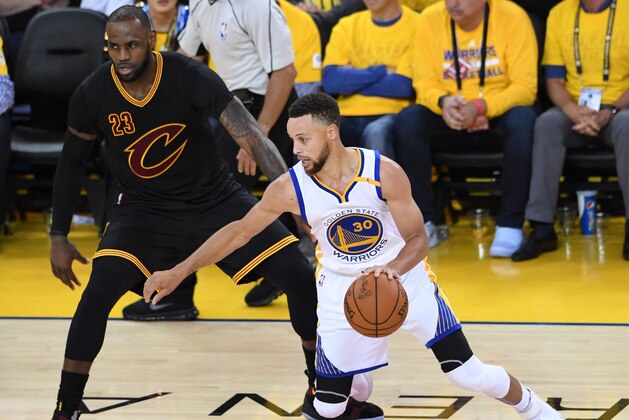 OAKLAND, CA - JUNE 12: Stephen Curry #30 of the Golden State Warriors \d\ LeBron James #23 of the Cleveland Cavaliers during the second half in Game 5 of the 2017 NBA Finals at ORACLE Arena on June 12, 2017 in Oakland, California. NOTE TO USER: User expressly acknowledges and agrees that, by downloading and or using this photograph, User is consenting to the terms and conditions of the Getty Images License Agreement.  (Photo by Thearon W. Henderson/Getty Images)