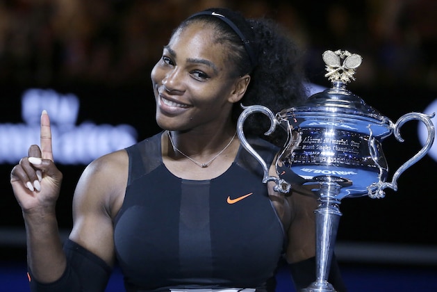 FILE - In this Jan. 28, 2017, file photo, Serena Williams holds up a finger and her trophy after defeating her sister, Venus, in the women's singles final at the Australian Open tennis championships in Melbourne, Australia. A spokeswoman for Williams says the tennis star is pregnant. Kelly Bush Novak wrote in an email to The Associated Press on Wednesday, April 19, 2017: