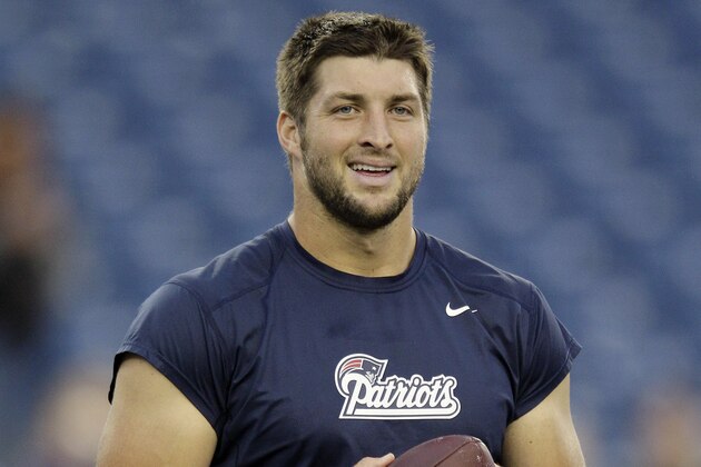 New England Patriots quarterback Tim Tebow warms up before an NFL preseason football game against the New York Giants Thursday, Aug. 29, 2013, in Foxborough, Mass. (AP Photo/Mary Schwalm)