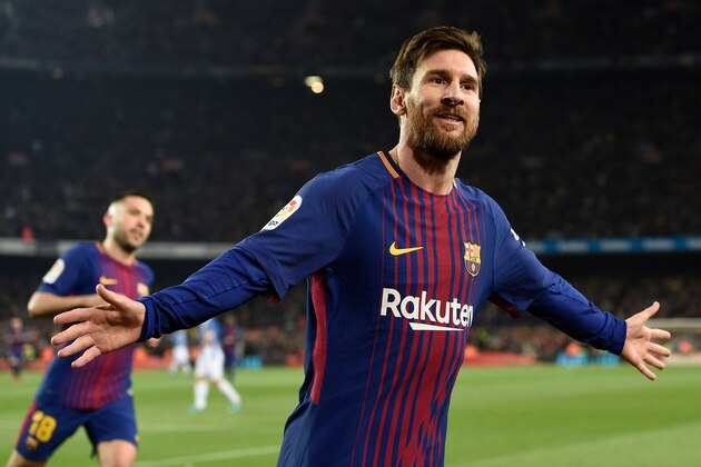 Barcelona's Argentinian forward Lionel Messi celebrates after scoring a goal during the Spanish 'Copa del Rey' (King's cup) quarter-final second leg football match between FC Barcelona and RCD Espanyol at the Camp Nou stadium in Barcelona on January 25, 2018.  / AFP PHOTO / LLUIS GENE        (Photo credit should read LLUIS GENE/AFP/Getty Images)