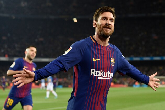Barcelona's Argentinian forward Lionel Messi celebrates after scoring a goal during the Spanish 'Copa del Rey' (King's cup) quarter-final second leg football match between FC Barcelona and RCD Espanyol at the Camp Nou stadium in Barcelona on January 25, 2018.  / AFP PHOTO / LLUIS GENE        (Photo credit should read LLUIS GENE/AFP/Getty Images)