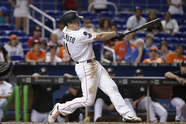 Miami Marlins' J.T. Realmuto (11) hits a game winning solo home run during the tenth inning of a baseball game against the New York Mets, Tuesday, Sept. 19, 2017, in Miami. The Marlins won 5-4 in ten innings. (AP Photo/Lynne Sladky)