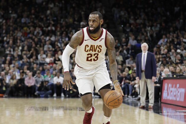 Cleveland Cavaliers forward LeBron James (23) brings the ball up court during the first half of an NBA basketball game against the San Antonio Spurs, Tuesday, Jan. 23, 2018, in San Antonio. James entered the game needing seven points to hit the 30,000 mark for career points; James scored 28 points. (AP Photo/Eric Gay)