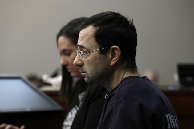 Dr. Larry Nassar listens as a victim gives her impact statement during the seventh day of his sentencing hearing Wednesday, Jan. 24, 2018, in Lansing, Mich. Nassar has admitted sexually assaulting athletes when he was employed by Michigan State University and USA Gymnastics, which is the sport's national governing organization and trains Olympians. (AP Photo/Carlos Osorio)
