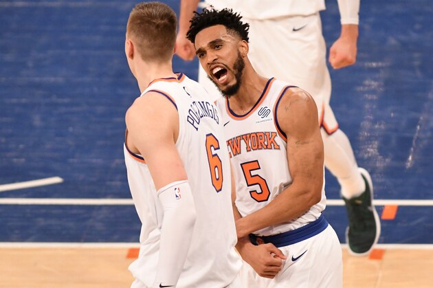 NEW YORK, NY - DECEMBER 25: Kristaps Porzingis #6 and Courtney Lee #5 of the New York Knicks celebrate during the game against the Philadelphia 76ers on December 25, 2017 at Madison Square Garden in New York City, New York. NOTE TO USER: User expressly acknowledges and agrees that, by downloading and/or using this photograph, user is consenting to the terms and conditions of the Getty Images License Agreement. Mandatory Copyright Notice: Copyright 2017 NBAE (Photo by Matteo Marchi/NBAE via Getty Images)