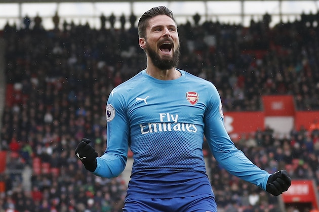 Arsenal's French striker Olivier Giroud celebrates scoring the team's first goal during the English Premier League football match between Southampton and Arsenal at St Mary's Stadium in Southampton, southern England on December 10, 2017. / AFP PHOTO / Adrian DENNIS / RESTRICTED TO EDITORIAL USE. No use with unauthorized audio, video, data, fixture lists, club/league logos or 'live' services. Online in-match use limited to 75 images, no video emulation. No use in betting, games or single club/league/player publications.  /         (Photo credit should read ADRIAN DENNIS/AFP/Getty Images)