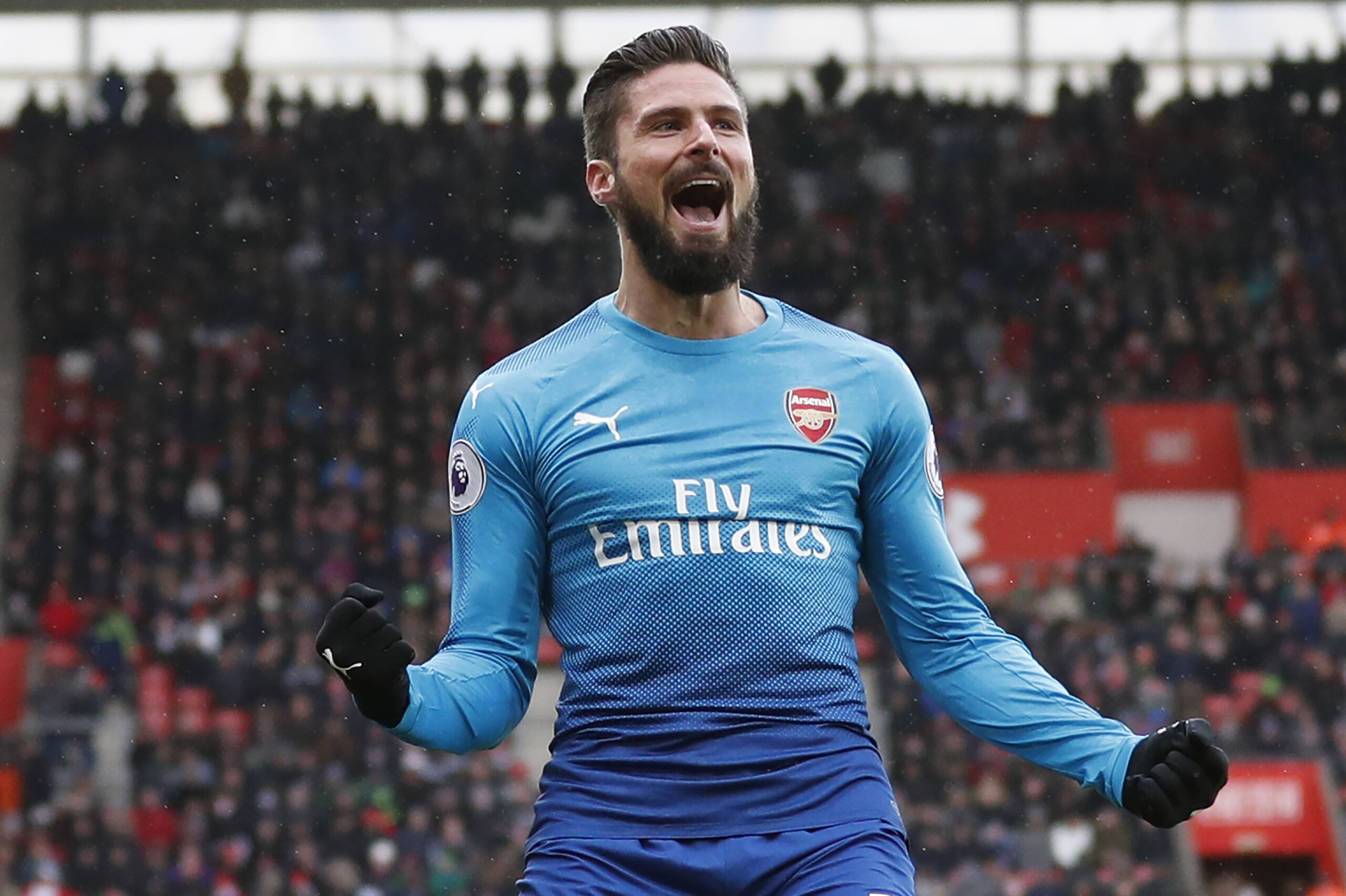 Arsenal's French striker Olivier Giroud celebrates scoring the team's first goal during the English Premier League football match between Southampton and Arsenal at St Mary's Stadium in Southampton, southern England on December 10, 2017. / AFP PHOTO / Adrian DENNIS / RESTRICTED TO EDITORIAL USE. No use with unauthorized audio, video, data, fixture lists, club/league logos or 'live' services. Online in-match use limited to 75 images, no video emulation. No use in betting, games or single club/league/player publications.  /         (Photo credit should read ADRIAN DENNIS/AFP/Getty Images)