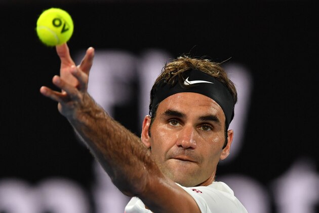 Switzerland's Roger Federer serves to South Korea's Chung Hyeon during their men's singles semi-finals match on day 12 of the Australian Open tennis tournament in Melbourne on January 26, 2018. / AFP PHOTO / Paul Crock / -- IMAGE RESTRICTED TO EDITORIAL USE - STRICTLY NO COMMERCIAL USE --        (Photo credit should read PAUL CROCK/AFP/Getty Images)