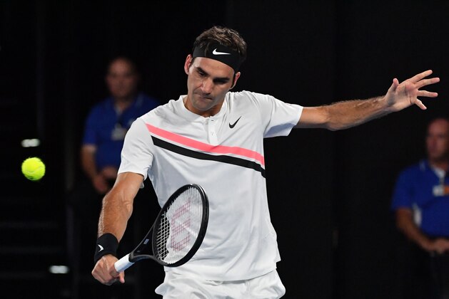 Switzerland's Roger Federer hits a return against South Korea's Chung Hyeon during their men's singles semi-finals match on day 12 of the Australian Open tennis tournament in Melbourne on January 26, 2018. / AFP PHOTO / SAEED KHAN / -- IMAGE RESTRICTED TO EDITORIAL USE - STRICTLY NO COMMERCIAL USE --        (Photo credit should read SAEED KHAN/AFP/Getty Images)