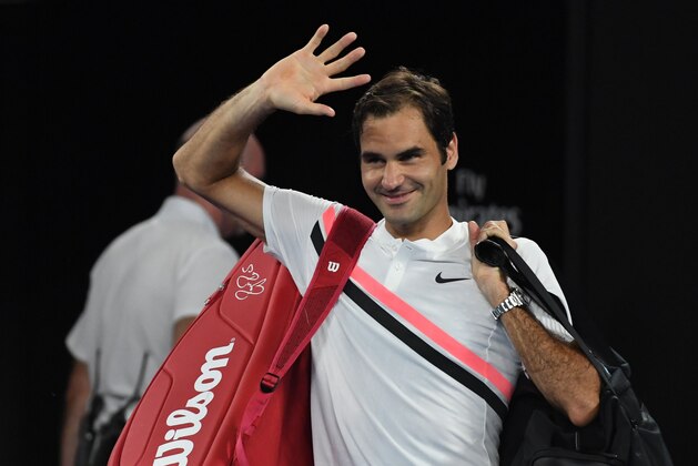 Switzerland's Roger Federer gestures after South Korea's Chung Hyeon retired from their men's singles semi-finals match on day 12 of the Australian Open tennis tournament in Melbourne on January 26, 2018. / AFP PHOTO / WILLIAM WEST / -- IMAGE RESTRICTED TO EDITORIAL USE - STRICTLY NO COMMERCIAL USE --        (Photo credit should read WILLIAM WEST/AFP/Getty Images)