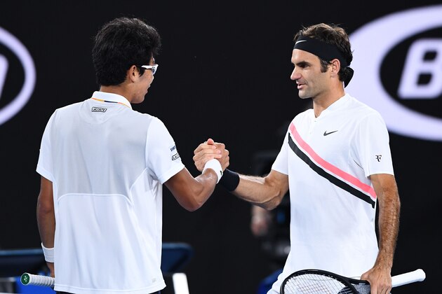 MELBOURNE, AUSTRALIA - JANUARY 26:  Hyeon Chung of South Korea shakes hands with Roger Federer of Switzerland after Chung retired hurt in their semi-final match against  on day 12 of the 2018 Australian Open at Melbourne Park on January 26, 2018 in Melbourne, Australia.  (Photo by Quinn Rooney/Getty Images)