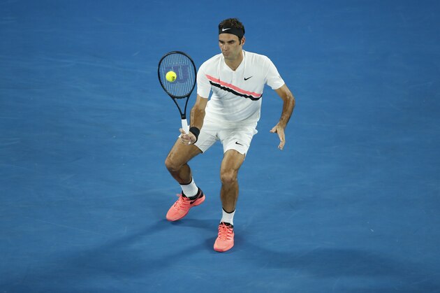 MELBOURNE, AUSTRALIA - JANUARY 26:  Roger Federer of Switzerland plays a backhand in his semi-final match against Hyeon Chung of South Korea on day 12 of the 2018 Australian Open at Melbourne Park on January 26, 2018 in Melbourne, Australia.  (Photo by XIN LI/Getty Images)