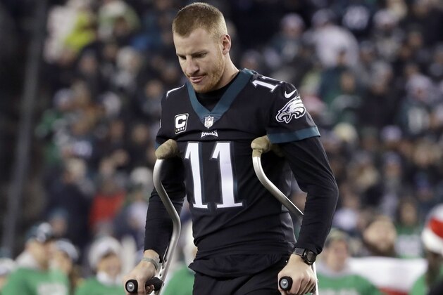 Philadelphia Eagles' Carson Wentz walks the field before an NFL football game against the Oakland Raiders, Monday, Dec. 25, 2017, in Philadelphia. (AP Photo/Michael Perez)