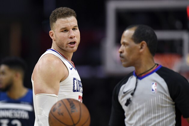 Los Angeles Clippers forward Blake Griffin, left, talks to referee Eric Lewis after receiving a technical foul during the second half of an NBA basketball game against the Minnesota Timberwolves, Monday, Jan. 22, 2018, in Los Angeles. The Timberwolves won 126-118. (AP Photo/Mark J. Terrill)