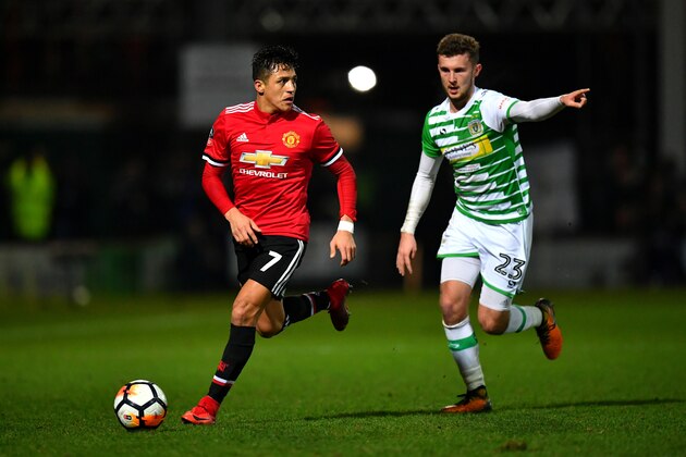 YEOVIL, ENGLAND - JANUARY 26:  Alexis Sanchez of Manchester United and Tom James of Yeovil Town during The Emirates FA Cup Fourth Round match between Yeovil Town and Manchester United at Huish Park on January 26, 2018 in Yeovil, England.  (Photo by Dan Mullan/Getty Images)