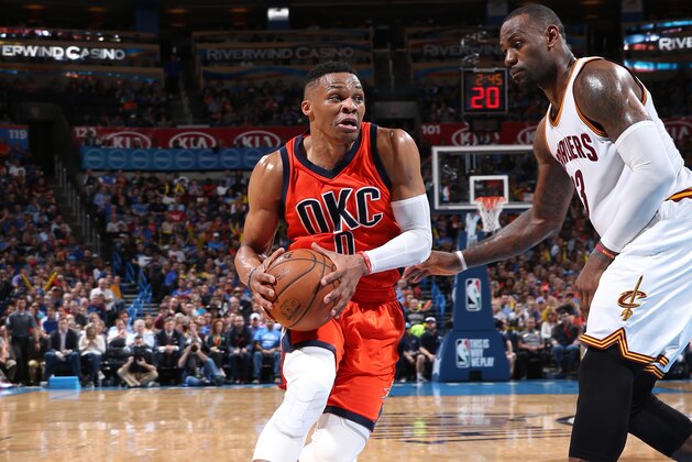 OKLAHOMA CITY, OK- FEBRUARY 21:  Russell Westbrook #0 of the Oklahoma City Thunder drives to the basket against LeBron James #23 of the Cleveland Cavaliers on February 21, 2016 at Chesapeake Energy Arena in Oklahoma City, Oklahoma. NOTE TO USER: User expressly acknowledges and agrees that, by downloading and or using this photograph, User is consenting to the terms and conditions of the Getty Images License Agreement. Mandatory Copyright Notice: Copyright 2016 NBAE (Photo by Joe Murphy/NBAE via Getty Images)