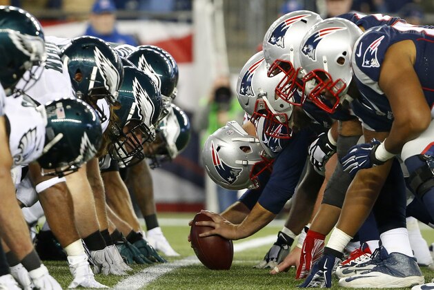 FILE - In this Dec. 6, 2015, file photo, the New England Patriots, right, and the Philadelphia Eagle get set for the snap at the line of scrimmage during an NFL football game at Gillette Stadium in Foxborough, Mass.  The two teams are set to meet in Super Bowl 52 on Sunday, Feb. 4, 2018, in Minneapolis. (Winslow Townson/AP Images for Panini via AP, File)