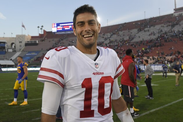 San Francisco 49ers quarterback Jimmy Garoppolo smiles as he walks off the field after their 34-13 win against the Los Angeles Rams during the second half of an NFL football game Sunday, Dec. 31, 2017, in Los Angeles. (AP Photo/Mark J. Terrill)