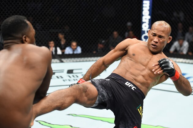 CHARLOTTE, NC - JANUARY 27:   (R-L) Ronaldo Souza of Brazil kicks Derek Brunson in their middleweight bout during a UFC Fight Night event at Spectrum Center on January 27, 2018 in Charlotte, North Carolina. (Photo by Josh Hedges/Zuffa LLC/Zuffa LLC via Getty Images)