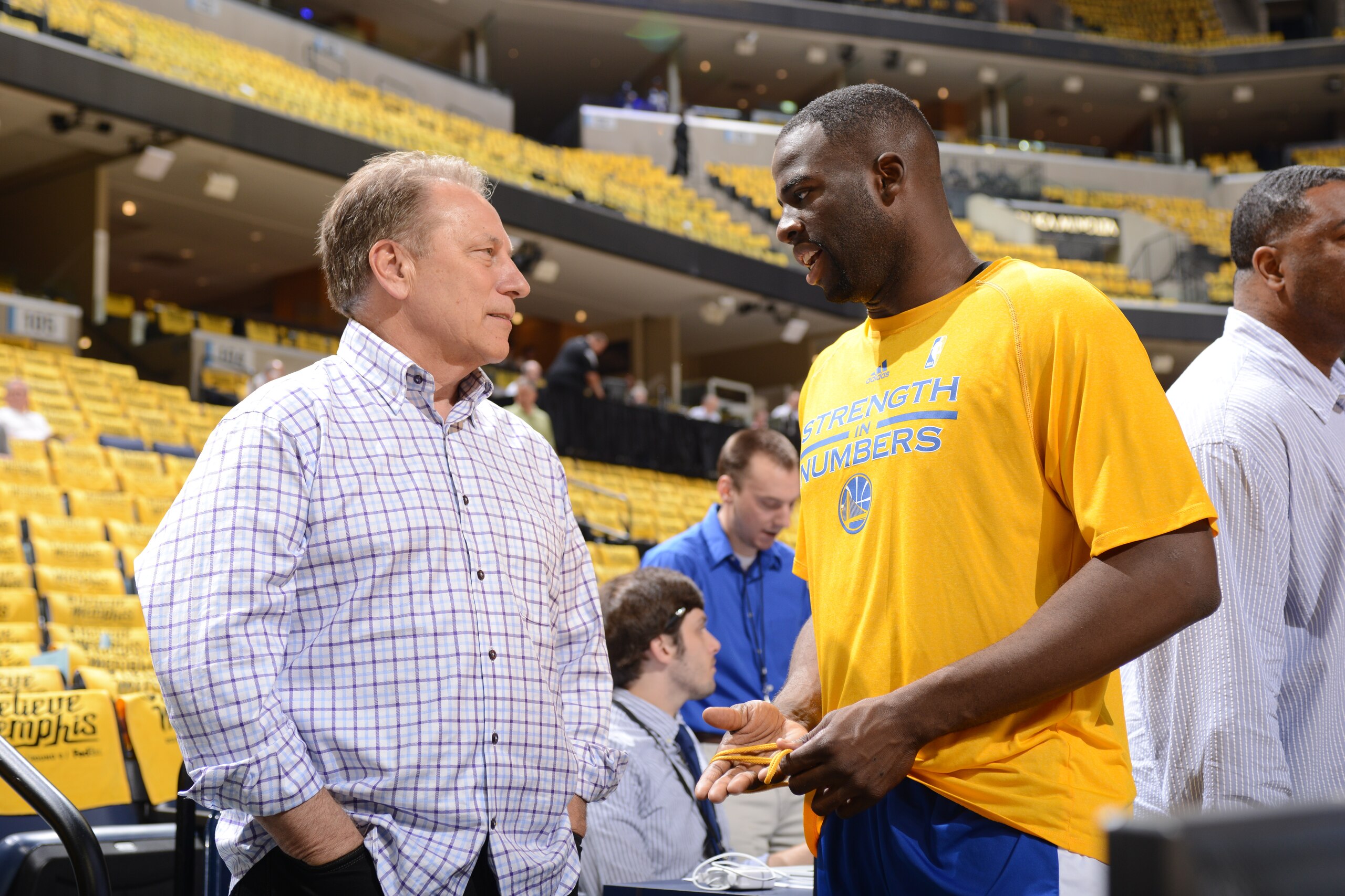 MEMPHIS, TENNESSEE - MAY 11: Michigan State head coach, Tom Izzo speaks to Draymond Green #23 of the Golden State Warriors before the Memphis Grizzlies face off against the Golden State Warriors for Game Four of the Western Conference Semifinals for the NBA Playoffs on May 11, 2015 at FedExForum in Memphis, Tennessee.  NOTE TO USER: User expressly acknowledges and agrees that, by downloading and or using this Photograph, user is consenting to the terms and conditions of the Getty Images License Agreement.  Mandatory Copyright Notice: Copyright 2015 NBAE (Photo by Noah Graham/NBAE via Getty Images)