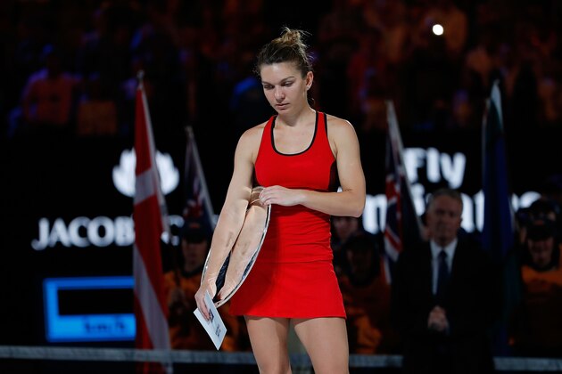 MELBOURNE, AUSTRALIA - JANUARY 27:  A dejected Simona Halep of Romania looks on after losing the women's singles final to Caroline Wozniacki of Denmark on day 13 of the 2018 Australian Open at Melbourne Park on January 27, 2018 in Melbourne, Australia. (Photo by Scott Barbour/Getty Images)