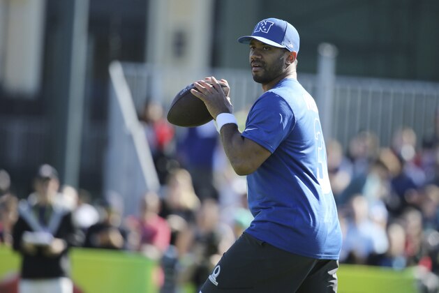 NFC quarterback Russell Wilson, of the Seattle Seahawks, prepares to throw a pass during Pro Bowl NFL football practice, Wednesday, Jan. 24, 2018, in Kissimmee, Fla. (AP Photo/Gregory Payan)