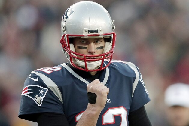 New England Patriots quarterback Tom Brady pumps his fist after a touchdown run by running back James White during the first half of the AFC championship NFL football game against the Jacksonville Jaguars, Sunday, Jan. 21, 2018, in Foxborough, Mass. (AP Photo/Charles Krupa)