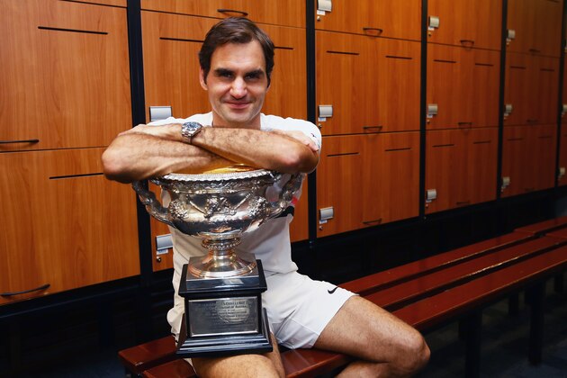 MELBOURNE, AUSTRALIA - JANUARY 28:  Roger Federer of Switzerland poses with the Norman Brookes Challenge Cup in the players locker room after winning the Men's Singles Final against Marin Cilic of Croatia on day 14 of the 2018 Australian Open at Melbourne Park on January 28, 2018 in Melbourne, Australia.  (Photo by Clive Brunskill/Getty Images)