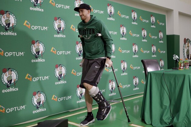 Boston Celtics' Gordon Hayward uses crutches as he steps away from a podium after taking questions from members of the media at an NBA basketball news conference, Thursday, Nov. 2, 2017 at the team's' training facility in Waltham, Mass. Hayward, who broke his ankle about 5 minutes into his NBA career opener at Cleveland on Oct. 17, says he knows he will not play again this season, after needing surgery to repair the injury. (AP Photo/Steven Senne)