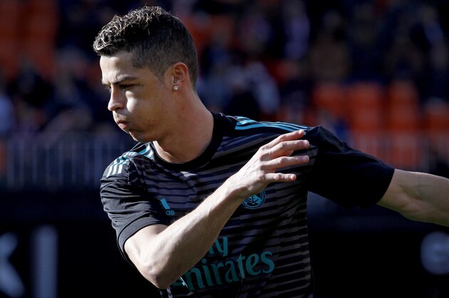 Real Madrid's Cristiano Ronaldo warms up prior to the start of the Spanish La Liga soccer match between Valencia and Real Madrid at the Mestalla stadium in Valencia, Spain, Saturday, Jan. 27, 2018. (AP Photo/Alberto Saiz)