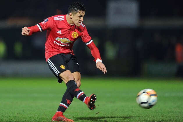 Manchester United's Chilean striker Alexis Sanchez takes a shot at goal during the FA Cup fourth round football match between Yeovil Town and Manchester United at Huish Park in Yeovil, Somerset on January 26, 2018. / AFP PHOTO / - / RESTRICTED TO EDITORIAL USE. No use with unauthorized audio, video, data, fixture lists, club/league logos or 'live' services. Online in-match use limited to 75 images, no video emulation. No use in betting, games or single club/league/player publications.  /         (Photo credit should read -/AFP/Getty Images)