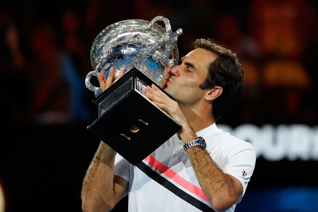 MELBOURNE, AUSTRALIA - JANUARY 28:  Roger Federer of Switzerland poses with the Norman Brookes Challenge Cup after winning the 2018 Australian Open Men's Singles Final against Marin Cilic of Croatia on day 14 of the 2018 Australian Open at Melbourne Park on January 28, 2018 in Melbourne, Australia.  (Photo by Scott Barbour/Getty Images)