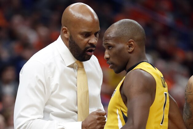 Missouri head coach Cuonzo Martin, left, talks with Terrence Phillips during the second half of an NCAA college basketball game against Illinois Saturday, Dec. 23, 2017, in St. Louis. Illinois won 70-64. (AP Photo/Jeff Roberson)