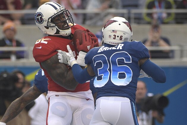 AFC tight end Delanie Walker (82), of the Tennessee Titans grabs a touchdown pass over NFC safety Budda Baker (36), of the Arizona Cardinals, during the second half of the NFL Pro Bowl football game, Sunday, Jan. 28, 2018, in Orlando, Fla. (AP Photo/Phelan M Ebenhack)