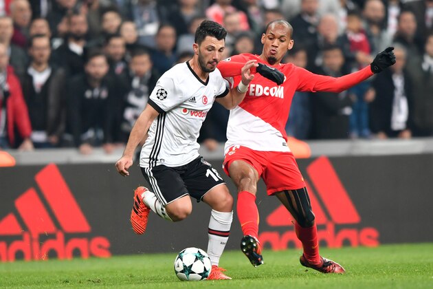 Besiktas' Turkish midfielder Tolgay Arslan (L) vies with Monaco's Brazilian defender Fabinho during the UEFA Champions League Group G football match between Besiktas and Monaco on November 1, 2017, at the Vodafone Park in Istanbul.  / AFP PHOTO / Bulent Kilic        (Photo credit should read BULENT KILIC/AFP/Getty Images)