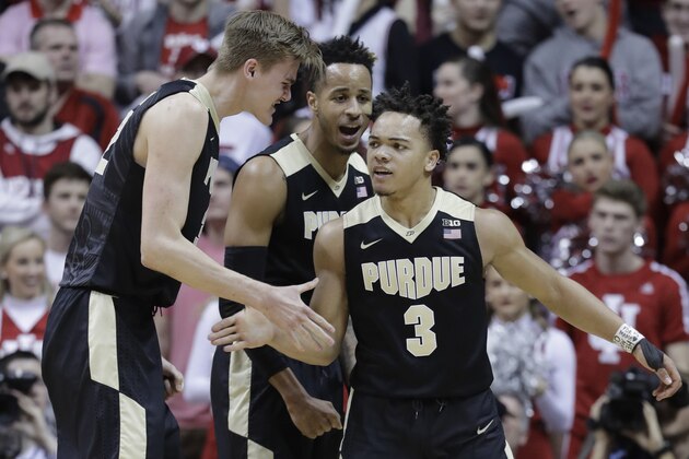 Purdue's Carsen Edwards (3) reacts with Matt Haarms, left, and Vincent Edwards following a dunk and a foul during the second half of an NCAA college basketball game against Indiana, Sunday, Jan. 28, 2018, in Bloomington, Ind. Purdue won 74-67. (AP Photo/Darron Cummings)