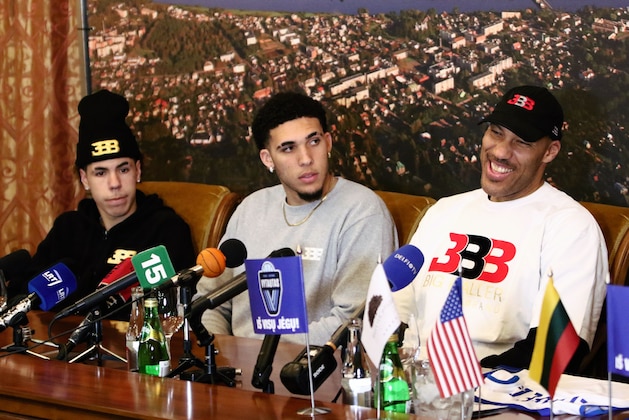 US basketball player (L-R) LaMelo Ball, LiAngelo Ball and their father LaVar Ball attend a press conference in Prienai, Lithuania, where they will play for the Vytautas club on January 5, 2018.
Basketball-crazed Lithuania welcomed LiAngelo and LaMelo Ball, the two youngest sons of flamboyant Los Angeles entrepreneur LaVar Ball who recently made headlines due to a feud with US President Donald Trump. / AFP PHOTO / Petras Malukas        (Photo credit should read PETRAS MALUKAS/AFP/Getty Images)