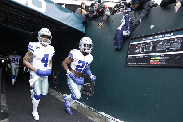 Dallas Cowboys' Dak Prescott, left, and Ezekiel Elliott run onto the field before an NFL football game against the Philadelphia Eagles, Sunday, Dec. 31, 2017, in Philadelphia. (AP Photo/Chris Szagola)