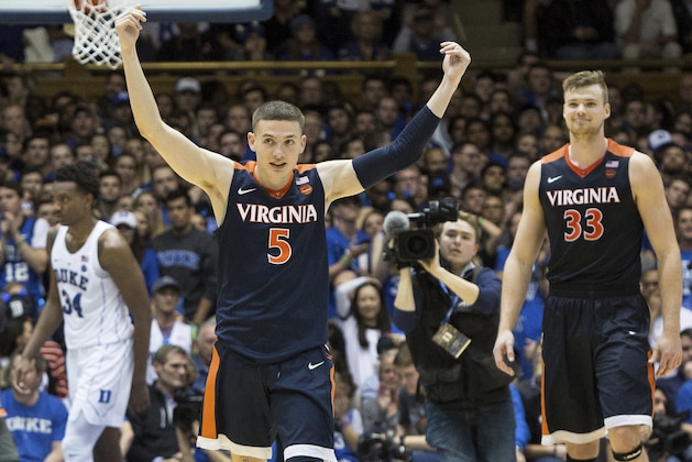 Virginia's Kyle Guy (5) and Jack Salt (33) walk off the court following a victory in an NCAA college basketball game against Duke in Durham, N.C., Saturday, Jan. 27, 2018. (AP Photo/Ben McKeown)