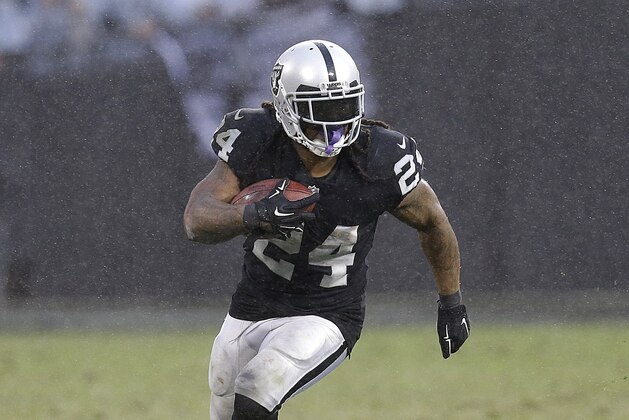 Oakland Raiders running back Marshawn Lynch (24) runs against the Denver Broncos during the second half of an NFL football game in Oakland, Calif., Sunday, Nov. 26, 2017. (AP Photo/Ben Margot)