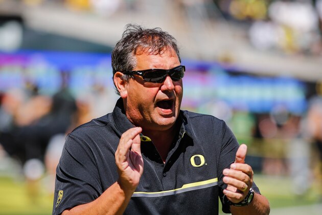 Oregon defensive coordinator Brady Hoke warms up the defensive linemen before playing UC Davis during an NCAA college football game in Eugene, Ore., Saturday, Sept. 3, 2016. (AP Photo/Thomas Boyd)
