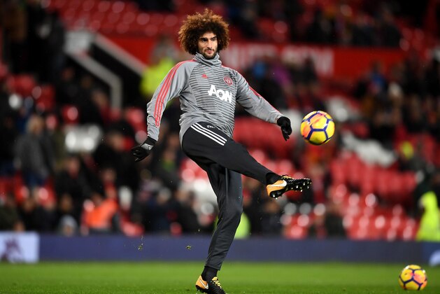 MANCHESTER, ENGLAND - JANUARY 15: Marouane Fellaini of Manchester United warms up prior to the Premier League match between Manchester United and Stoke City at Old Trafford on January 15, 2018 in Manchester, England.  (Photo by Michael Regan/Getty Images)