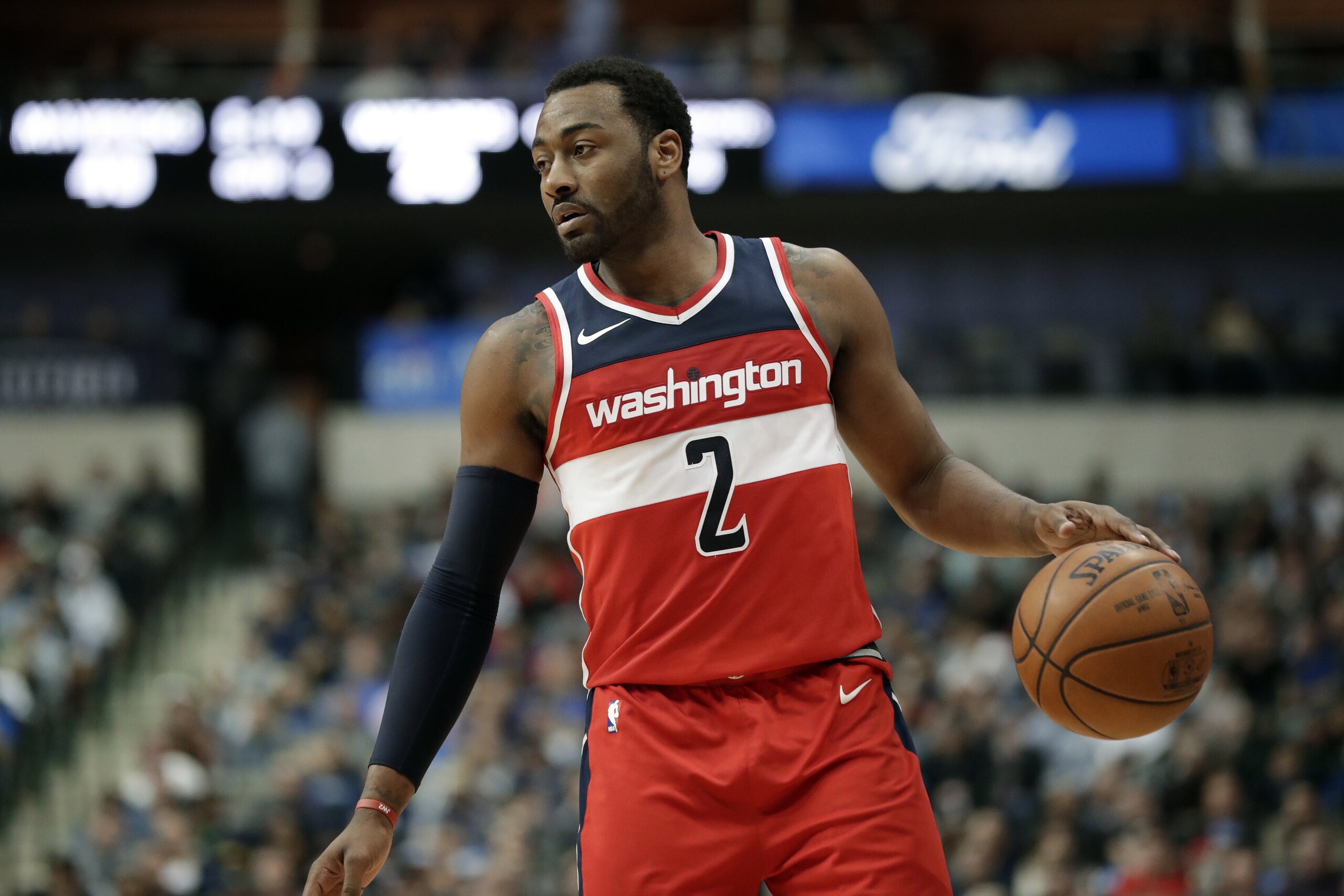 Washington Wizards' John Wall (2) handles the ball during an NBA basketball game against the Dallas Mavericks on Monday, Jan. 22, 2018, in Dallas. (AP Photo/Tony Gutierrez)