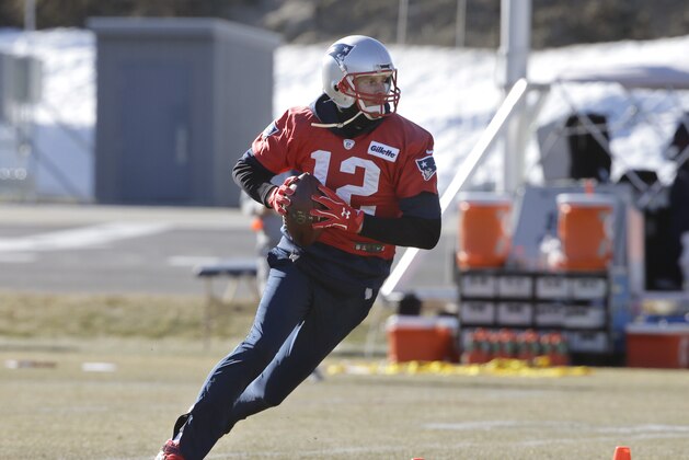 New England Patriots quarterback Tom Brady runs with the ball during an NFL football practice, Thursday, Jan. 25, 2018, in Foxborough, Mass. The Patriots are to play the Philadelphia Eagles in Super Bowl 52 on Sunday, Feb. 4, in Minneapolis. (AP Photo/Steven Senne)