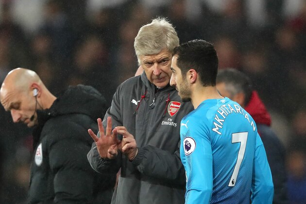 SWANSEA, WALES - JANUARY 30:  Arsenal Head Coach / Manager Arsene Wenger gives instructions to Henrikh Mkhitaryan of Arsenal as he prepares to come on as a substitute during the Premier League match between Swansea City and Arsenal at Liberty Stadium on January 30, 2018 in Swansea, Wales.  (Photo by Matthew Ashton - AMA/Getty Images)